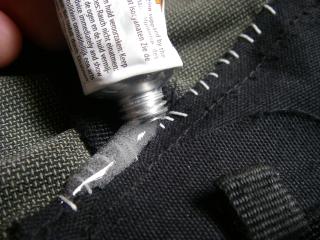 Using urethane sealant over a sewn repair